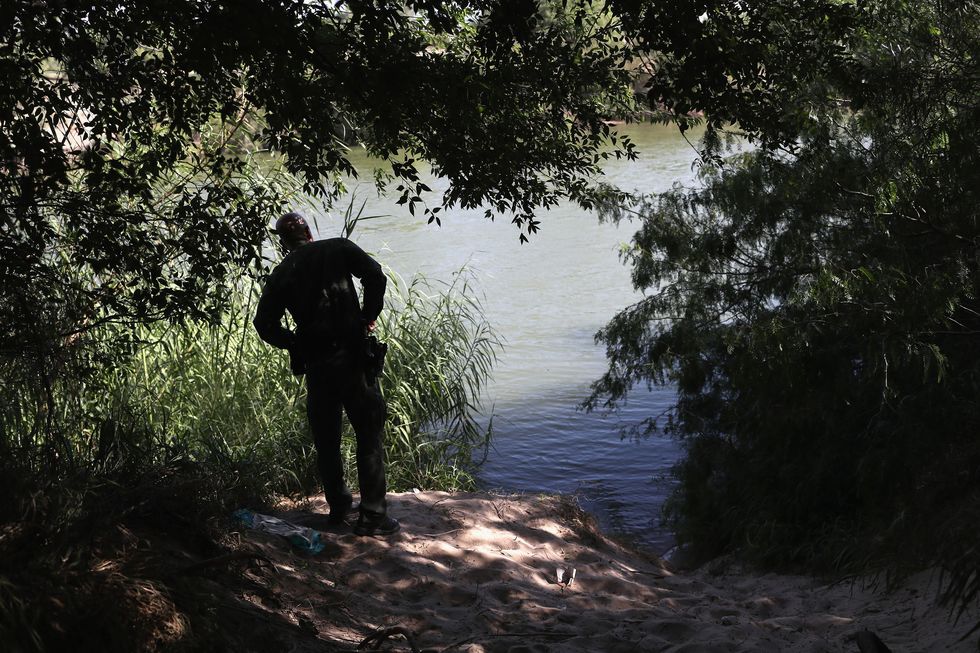 A U.S. border patrol agent monitors the Rio Grande.