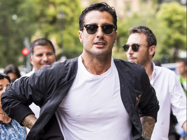 florence, italy   june 13  fabrizio corona, wearing white t shirt and blue jacket, is seen during the 94th pitti immagine uomo at fortezza da basso on june 13, 2018 in florence, italy photo by claudio laveniagetty images