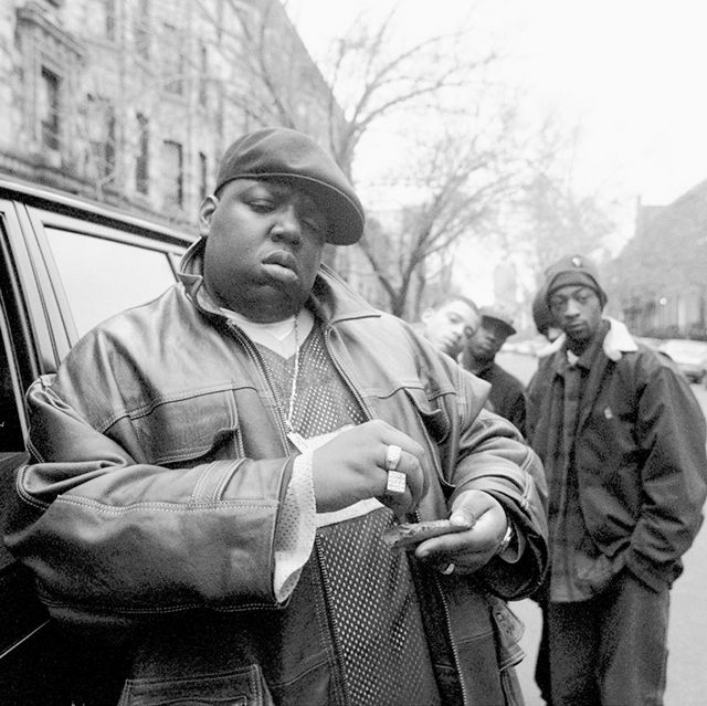 american rapper notorious big, aka biggie smalls, aka chris wallace 1972   1997, rolls a cigar outside his mother's house in brooklyn, new york, 18th january 1995  photo by clarence davisny daily news archive via getty images