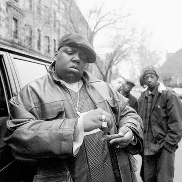 american rapper notorious big, aka biggie smalls, aka chris wallace 1972   1997, rolls a cigar outside his mother's house in brooklyn, new york, 18th january 1995  photo by clarence davisny daily news archive via getty images