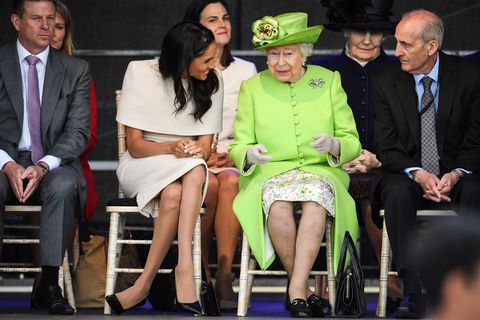 chester, england   june 14  queen elizabeth ii sits and laughs with meghan, duchess of sussex during a ceremony to open the new mersey gateway bridge on june 14, 2018 in the town of widnes in halton, cheshire, england meghan markle married prince harry last month to become the duchess of sussex and this is her first engagement with the queen during the visit the pair will open a road bridge in widnes and visit the storyhouse and town hall in chester  photo by jeff j mitchellgetty images