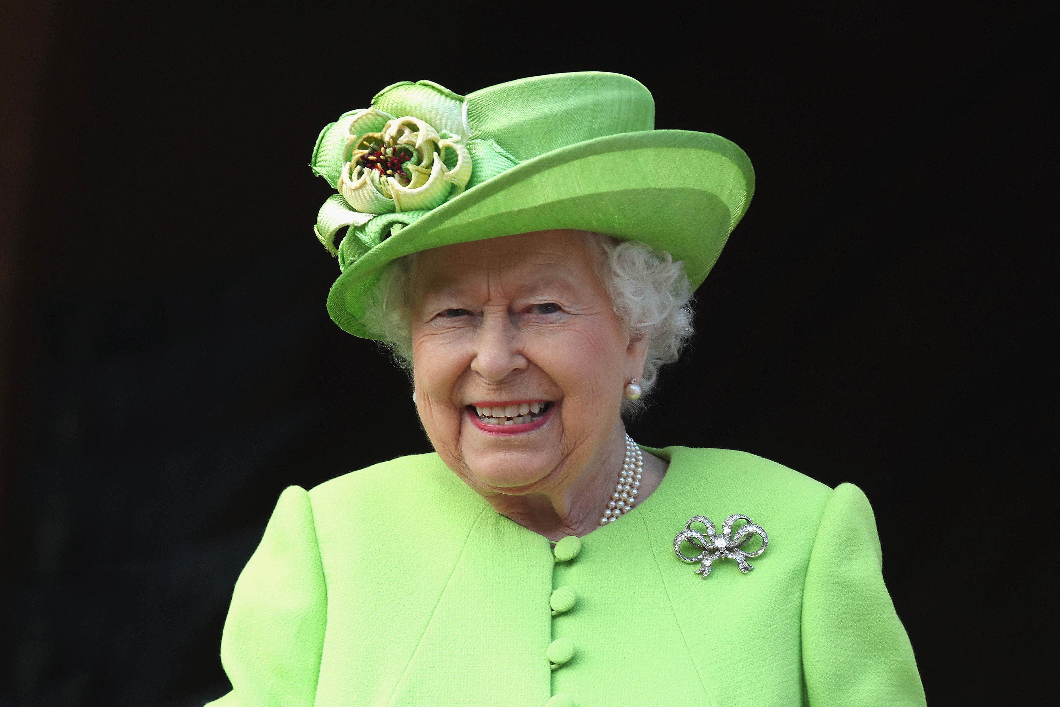 Why Queen Elizabeth Wore Green Today - #GreenforGrenfell Honors Fire Victims