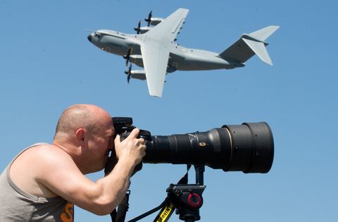 07 june 2018, germany, wunstorf planespotter bernd selbmann takes a picture as a luftwaffe airbus a400m flies past during the german bundeswehrs spotterday at wunstorf airbase near hanover at spotterday, 300 photographers were able to take pictures of bundeswehr aircraft in action photo julian stratenschultedpa photo by julian stratenschultepicture alliance via getty images