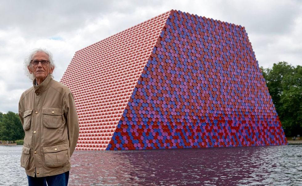 bulgarian artist christo vladimirov javacheff, better known as christo, poses for a photograph as he unveils his artwork, the mastaba on the serpentine lake in hyde park in london on june 18, 2018   christos first uk outdoor work is a 20m high installation made from over 7000 coloured, horizontally stacked barrels on a floating platform photo by niklas hallen  afp  restricted to editorial use   mandatory mention of the artist upon publication   to illustrate the event as specified in the caption photo by niklas hallenafp via getty images