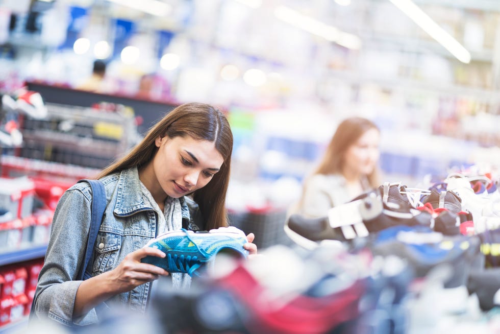 woman looking shoes in store