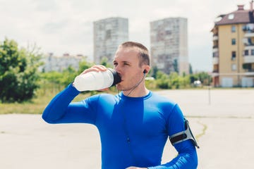 sportsman drinking water outside