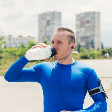 Man sport sportsman drinking water outside