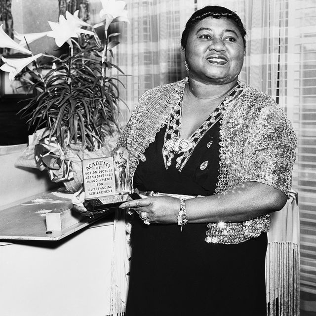 american actress hattie mcdaniel 1895   1952 with her academy award of merit for outstanding achievement, circa 1945 mcdaniel won an oscar for best supporting actress for her role of mammy in gone with the wind, making her the first african american to win an academy award photo via john kobal foundationgetty images