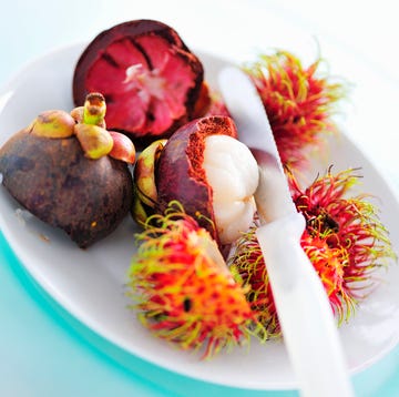 Partly peeled mangosteen and rambutans, close-up partly peeled mangosteen and rambutans, closeup