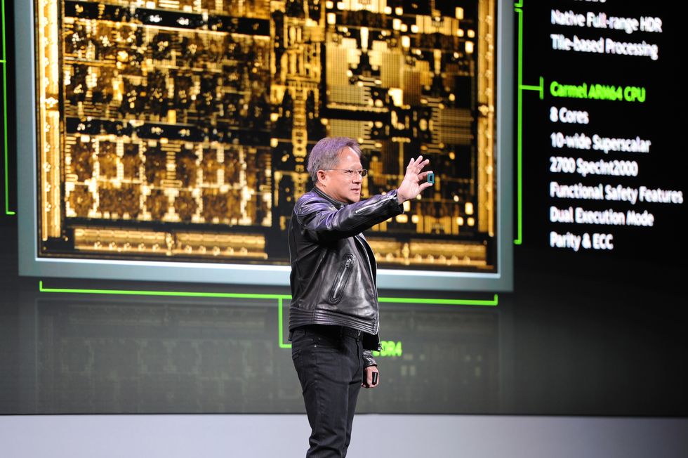 jensen huang, head of chip manufacturer nvidia, shows a prototype of the new chip called drive xavier for autonomous driving during the technological fair ces 2018 in las vegas, usa, 8 january 2018 photo andrej sokolowdpa photo by andrej sokolowpicture alliance via getty images