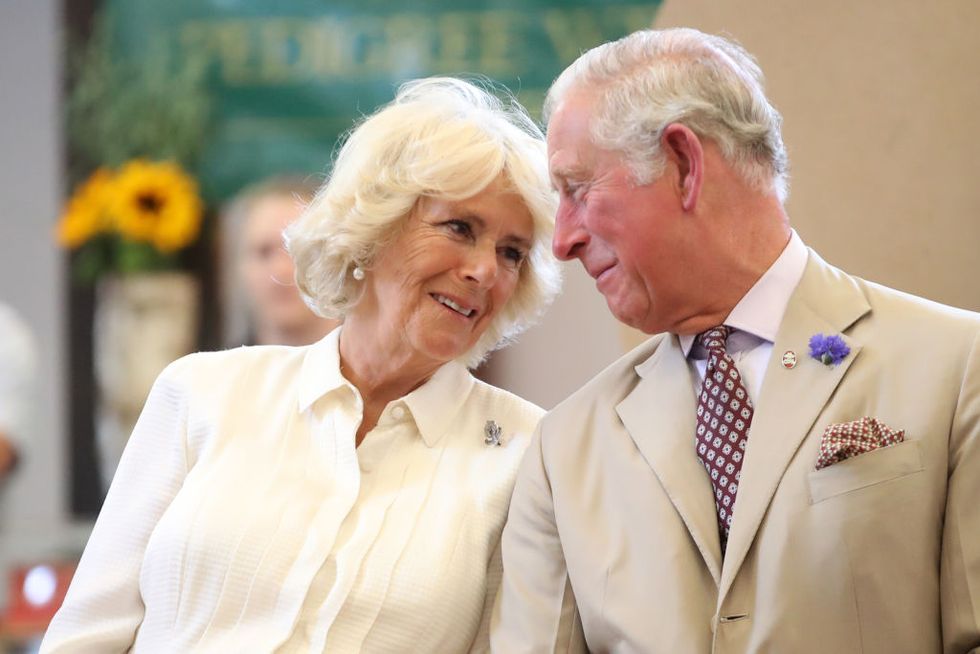 builth wells, wales july 04 prince charles, prince of wales and camilla, duchess of cornwall look at eachother as they reopen the newly renovated edwardian community hall the strand hall during day three of a visit to wales on july 4, 2018 in builth wells, wales photo by chris jacksongetty images