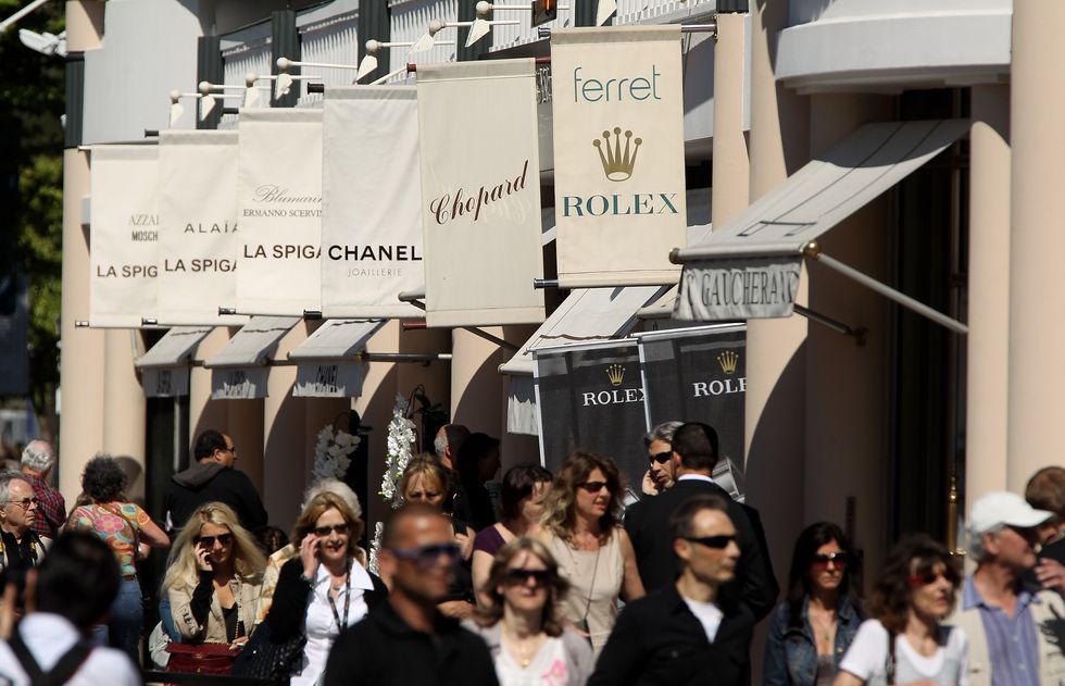 cannes, france may 13 people walk past luxury stores along the croisette during the 63rd cannes film festival on may 13, 2010 in cannes, france shopping and luxury brands are an intrinsic aspect of the annual film festival at cannes photo by sean gallupgetty images