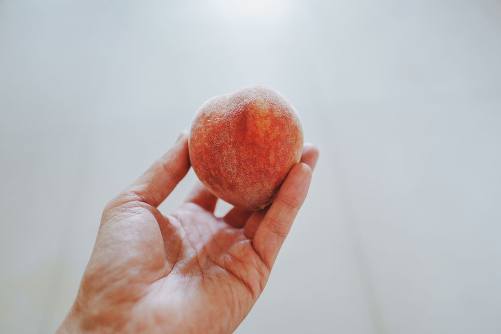 Take a peach in one hand