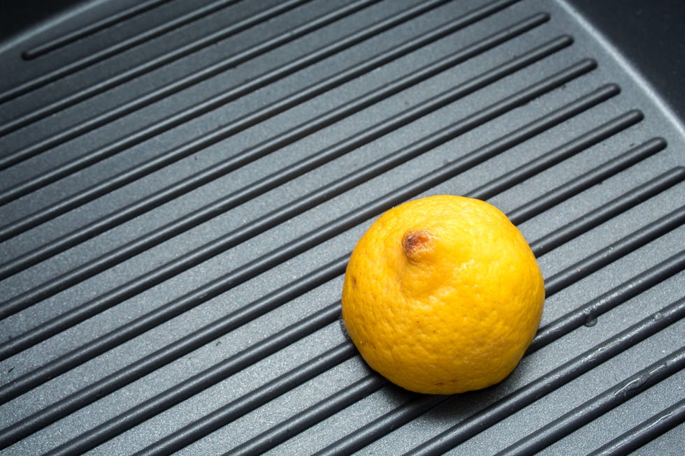 black grill pan background with lemon
