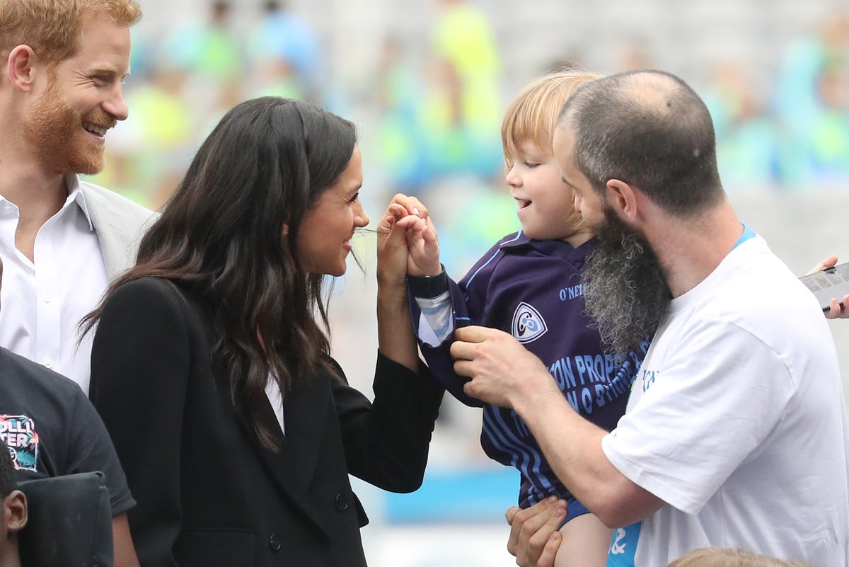 The Story Behind That Adorable Photo of Meghan Markle and Prince Harry ...