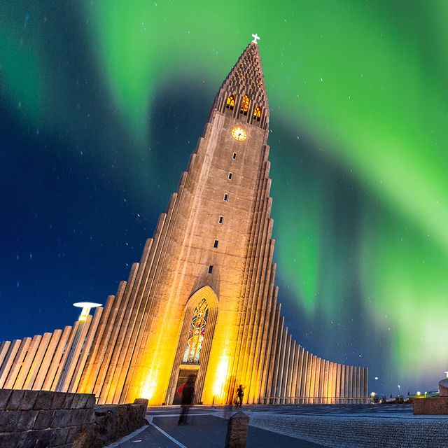 aurora borealis above hallgrimskirkja church in central of reykjavik city in iceland