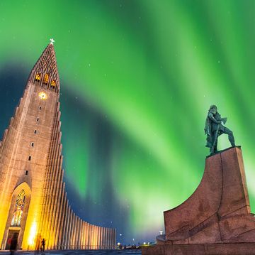 aurora borealis above hallgrimskirkja church in central of reykjavik city in iceland
