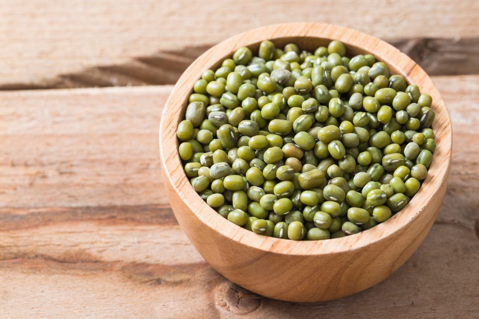 bowl of mung beans on a wood background