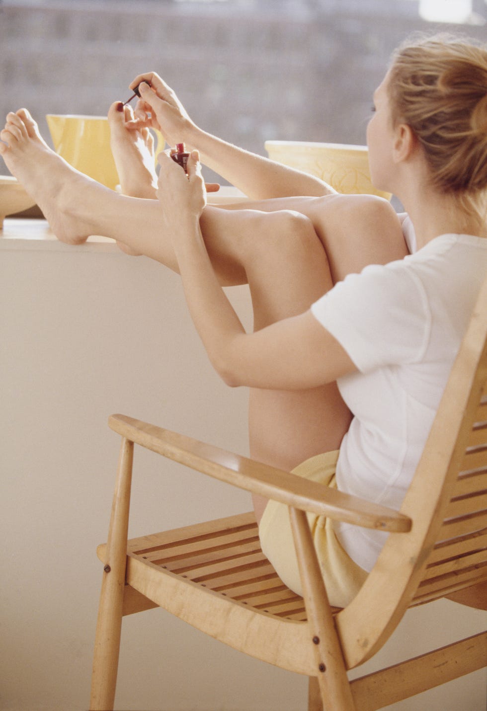 Woman Painting Toenails