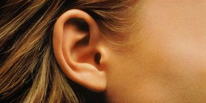 Ear, Hair, Face, Earrings, Organ, Close-up, Hearing, Chin, Body piercing, Cheek, 
