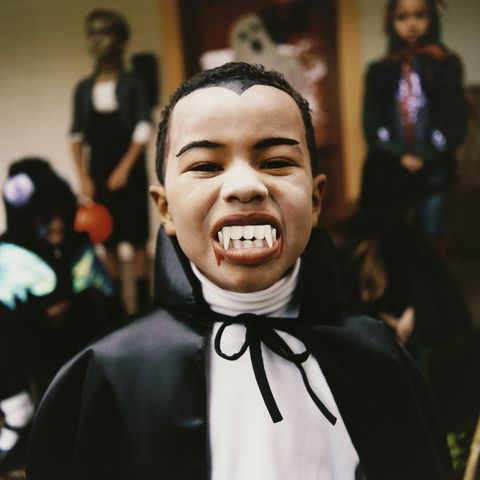 portrait of a boy wearing a vampire costume