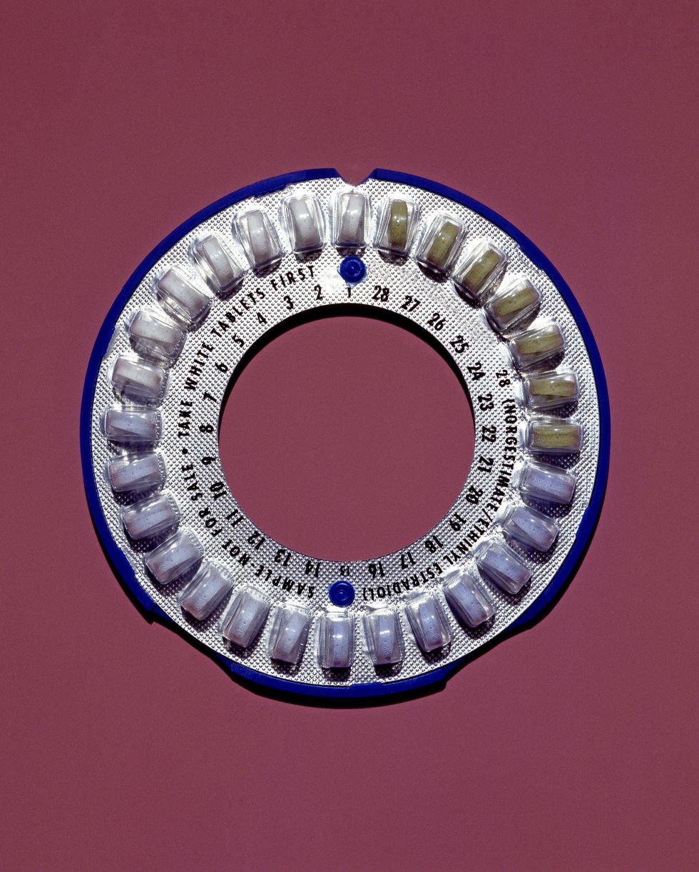 Round package of contraceptive pills, studio shot