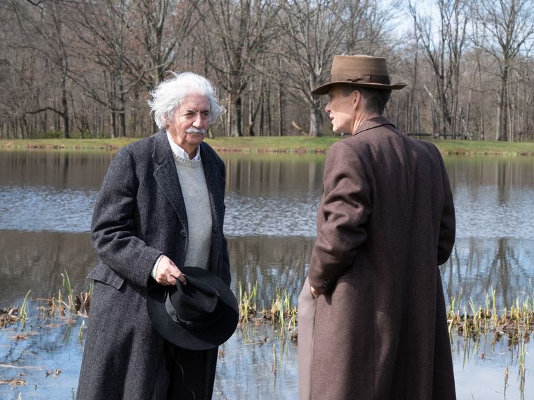 l to r tom conti is albert einstein and cillian murphy is j robert oppenheimer in oppenheimer, written, produced, and directed by christopher nolan