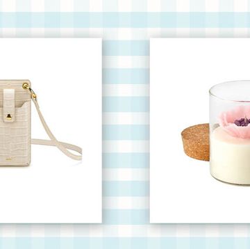 beige vegan crocodile skin phone carrying bag and a candle featured on a blue and white background