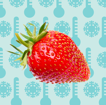 fresh whole strawberry against a blue background