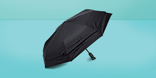 a black umbrella on a blue background
