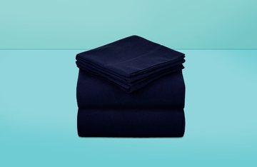 stack of navy flannel sheets on a blue background