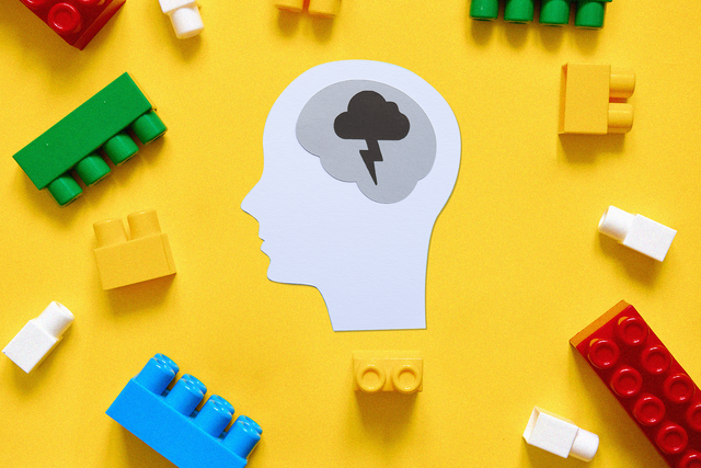 cut out head surrounded by legos