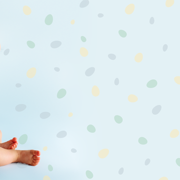 baby boy set against a fun, polkadot background in a story about baby boy names