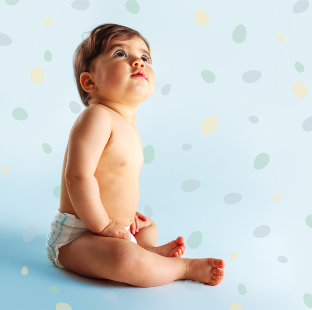 baby boy set against a fun, polkadot background in a story about baby boy names