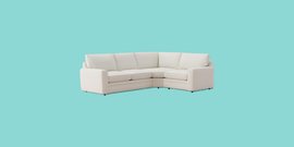 a white couch on a blue background