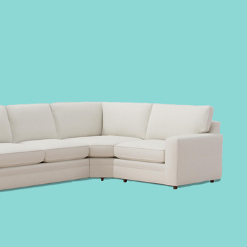 a white couch on a blue background