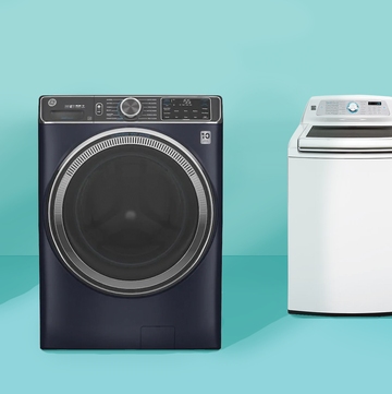 3 black navy and white washing machines on blue background