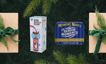 gift items including a wine bottle glass and memory mints near wrapped presents