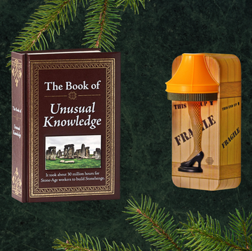 dirty santa gifts the book of unusual knowledge and a christmas story lamp night light surrounded by christmas presents