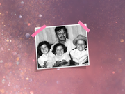 family photo with three children and an adult sitting together in black and white
