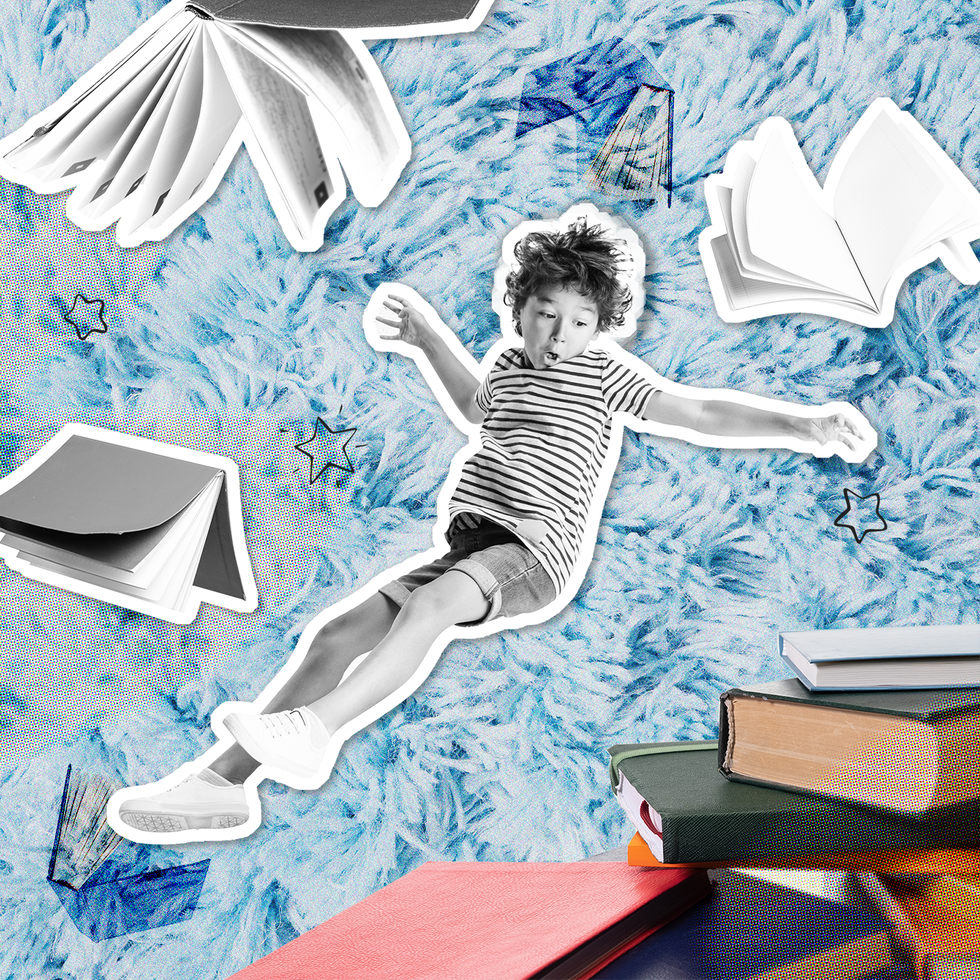 boy jumping into a stack of books
