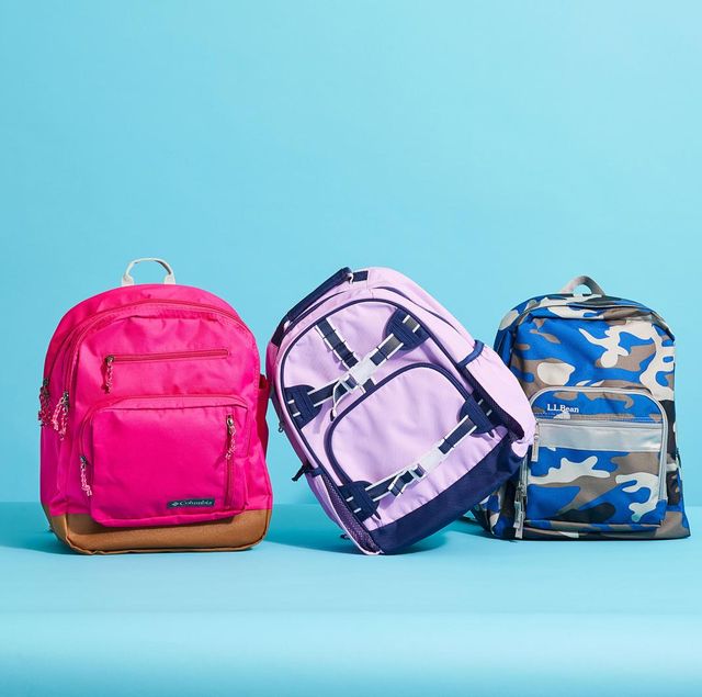 pink, blue and purple backpacks against a blue background to show good housekeeping's picks for the best kids backpacks
