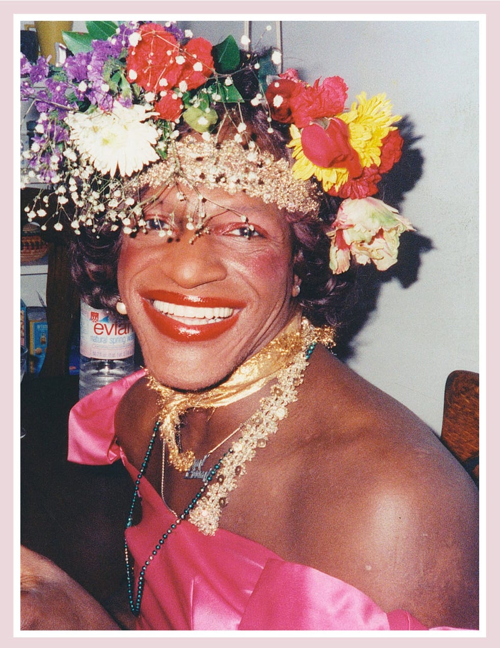Pink, Headpiece, Smile, Headgear, Fashion accessory, Lei, Flower, Plant, Costume, Hair accessory, 