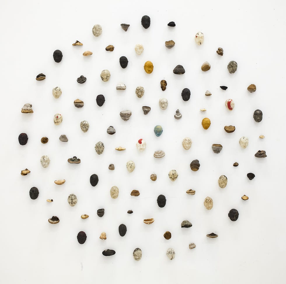 a collection of small decorative objects arranged on a white background