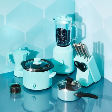 lifestyle shot of kitchen appliances with blue tones against blue patterned background