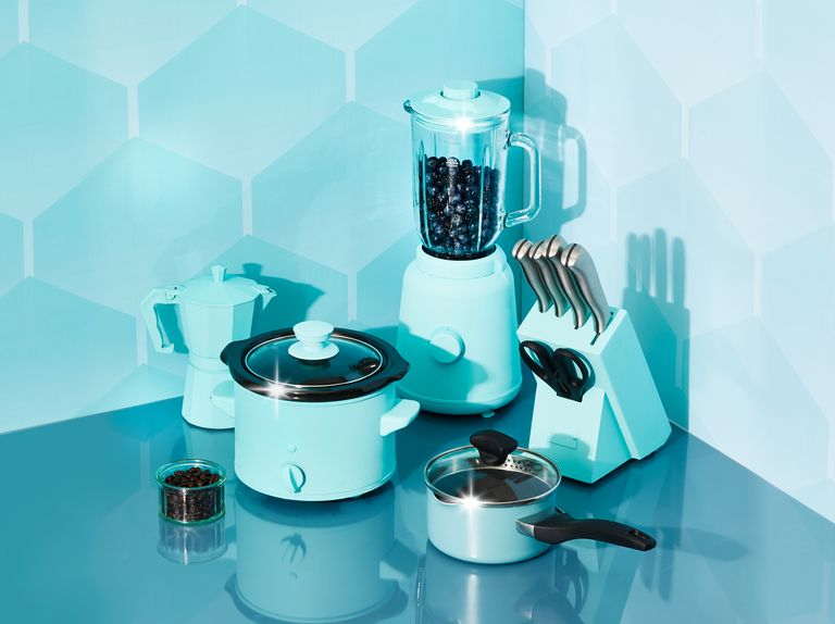 lifestyle shot of kitchen appliances with blue tones against blue patterned background