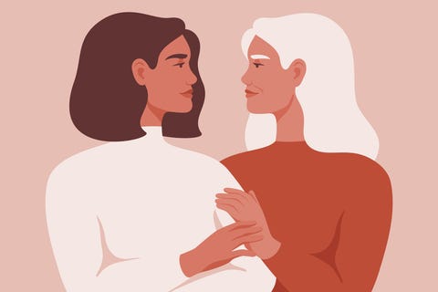beautiful senior mother and her adult daughter are embracing and looking at each other in the face the concept of motherhood, friendship, care and love