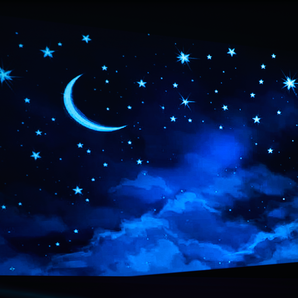 night sky featuring a crescent moon and stars