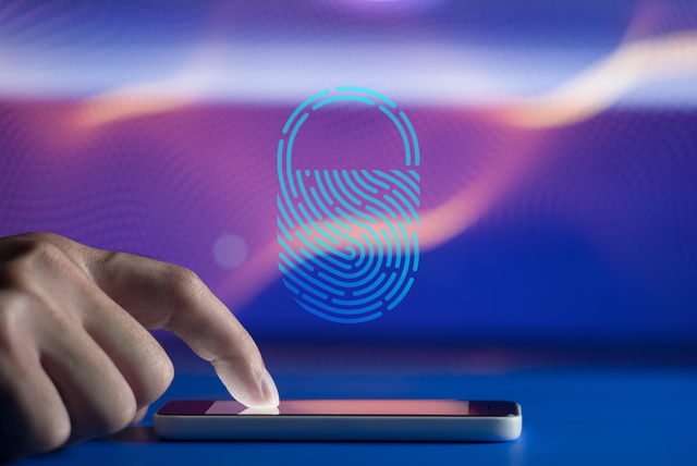 hand touching phone screen with icon of fingerprint