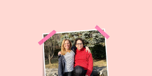 the writer right and her bff, alexandra left, with arms around each other while sitting on a stone wall the started their friendship when andrea, the writer, was in her 50s